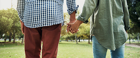 Couple holding hands.