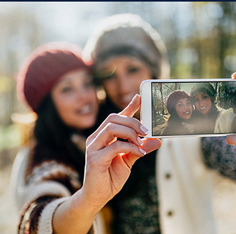 Women taking selfie.